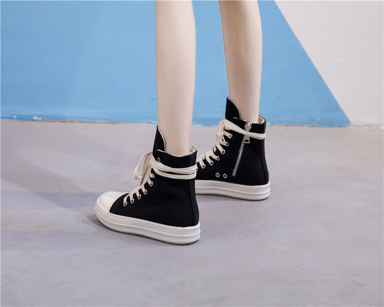 High top retro platform sneakers in black with white laces, perfect for unisex alternative fashion lovers.