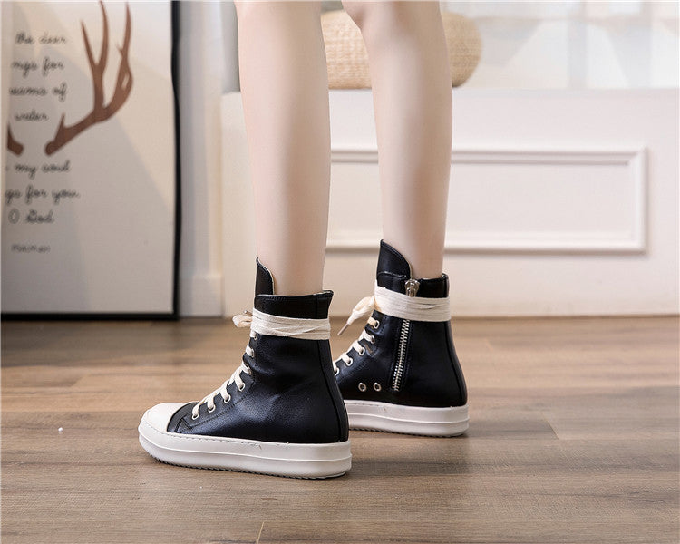High top retro platform sneakers for rock lovers, stylish unisex design in black with white accents.