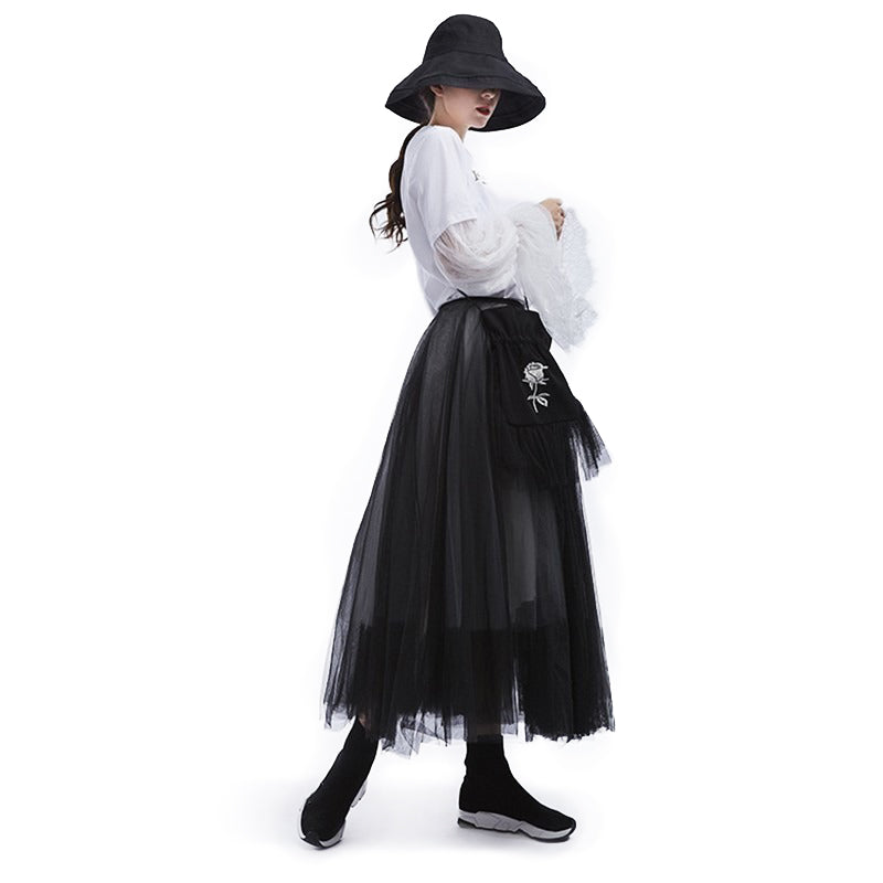 Gothic fashion women in a high waist black mesh skirt, showcasing a stylish blend of elegance and attitude.