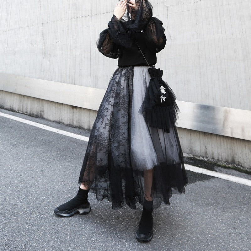 Gothic black half-body skirt with layers and asymmetrical cut, perfect for cosplay and fashion-forward looks.