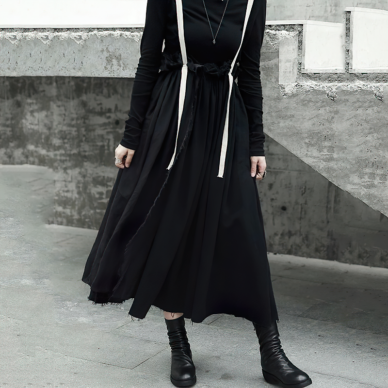 High-waist black skirt with white straps, perfect for vintage streetwear style.