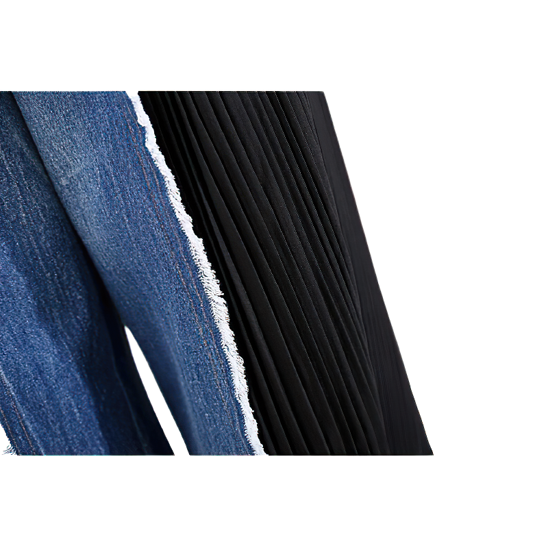 Close-up of blue denim and black pleated fabric showing stylish texture and design for women's wide trousers.