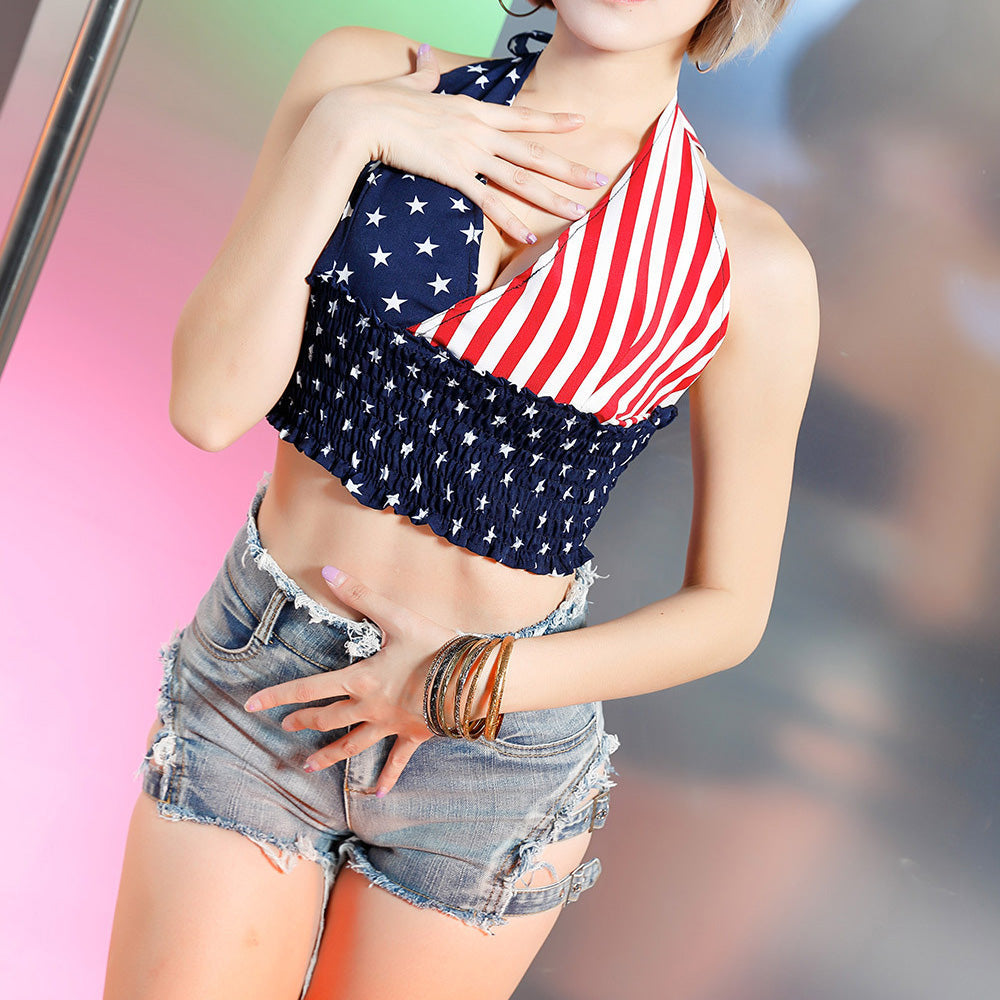 Stylish woman in a patriotic halter top and distressed denim shorts, perfect for a rocker chic summer look.