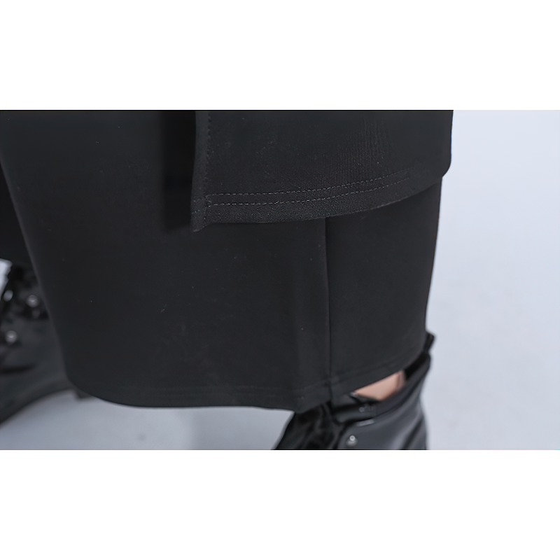 Close-up of high waist elastic women's pants in black, showcasing the stylish cut and detail with edgy black boots.