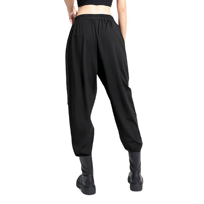 Women's high waist elastic black trousers showcasing a trendy back view, perfect for streetwear and seasonal fashion.