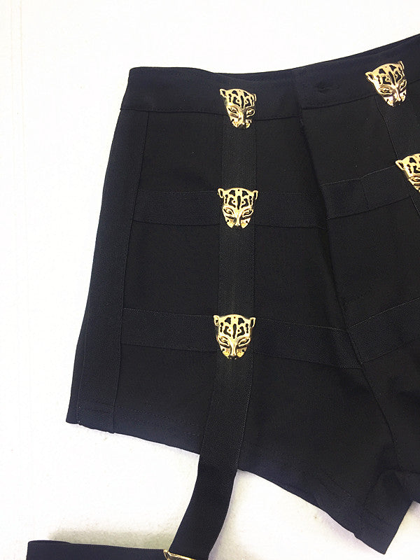 High waist short shorts for women with metallic leopard buttons and leg belts, perfect for rave outfits.