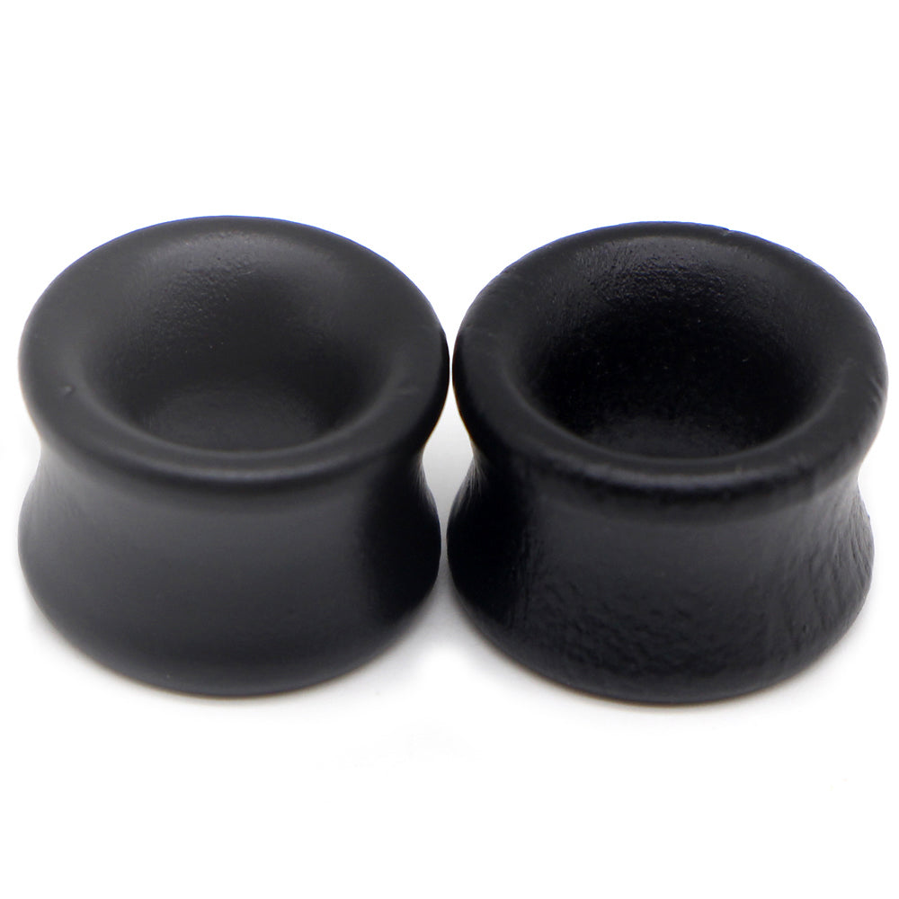 Hollow black wood plugs and tunnels for body piercing, perfect unisex earring stretcher for a punk fashion look.