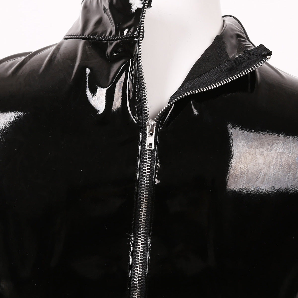 Close-up of a glossy black latex bodysuit with a zipper, ideal for gothic fashion styles and bold looks.