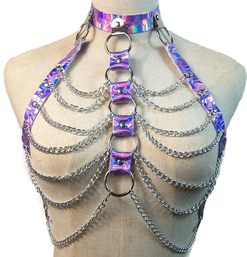 Holographic chain body harness with silver chains and rings, perfect for gothic rave and festival outfits.