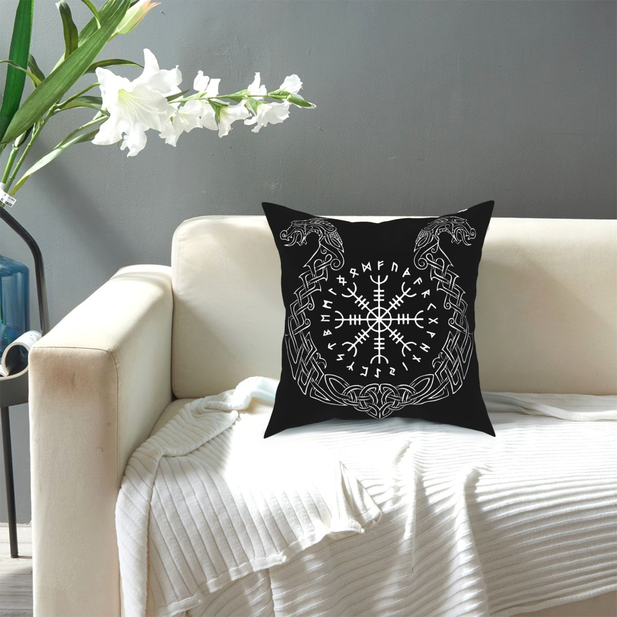 Viking Helm of Awe decorative pillow cover on a couch, featuring contrasting black and white design, perfect for home decor.
