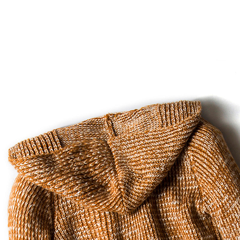 Close-up of the hood of a knitted men's cardigan trench coat in a warm brown hue, showcasing alternative fashion style.