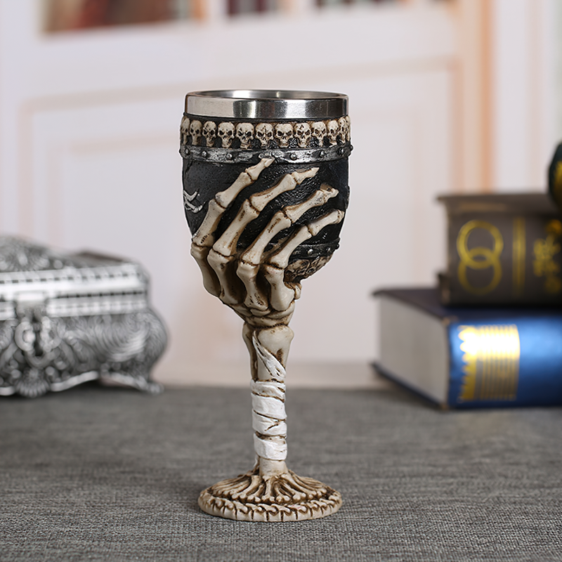 Horrible Death Claw wine glass featuring a skeletal hand and skull detail, perfect for vintage goth decor.