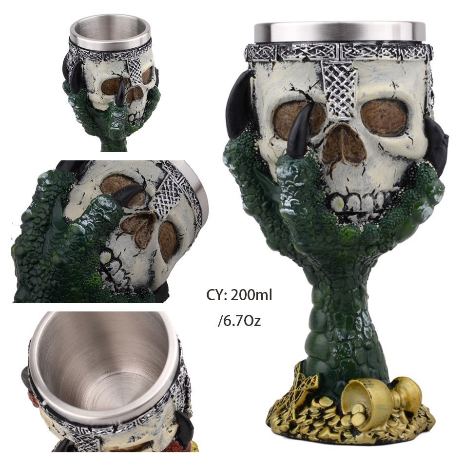 Vintage green devil hand wine glass with skull and stainless steel interior, perfect for themed parties.