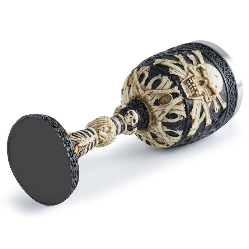 Horrible skull wine glass with a flame design, gothic style stainless steel and resin, perfect for decor or gifting.