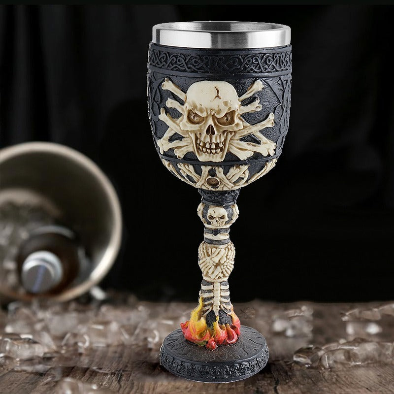 Gothic vintage skull wine glass with stainless steel top, flame details, and bone decorations, perfect for bar decor.