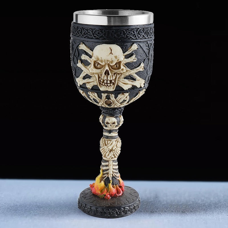 Gothic vintage wine glass featuring a skull and bone design with a stainless steel top and flame details.
