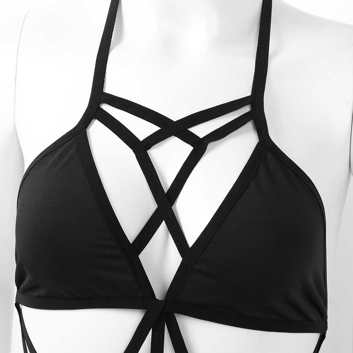 Close-up of a stylish black monokini top with crisscross straps, perfect for swimsuits or dance attire.