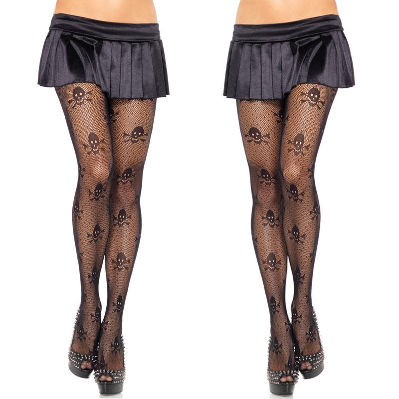 Womens gothic skull stockings paired with a black skirt, perfect for Halloween parties and edgy outfits.