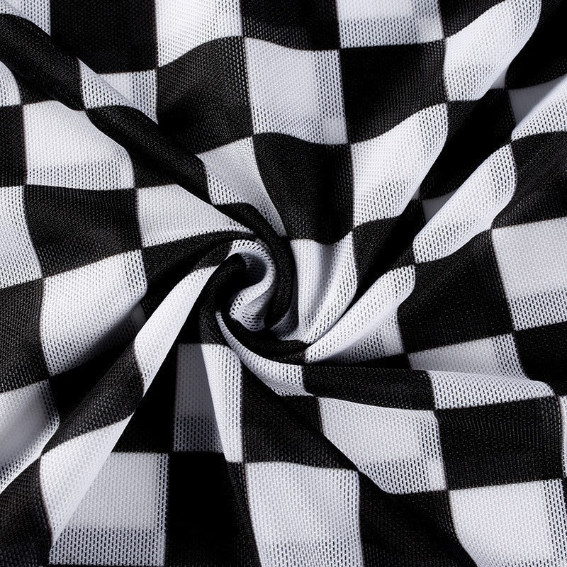Close-up of black and white checkerboard mesh fabric, perfect for grunge-style apparel and trendy long sleeve tops.