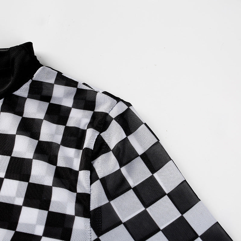 Close-up of a stylish black and white checkered mesh top, perfect for a grunge-inspired women's outfit.