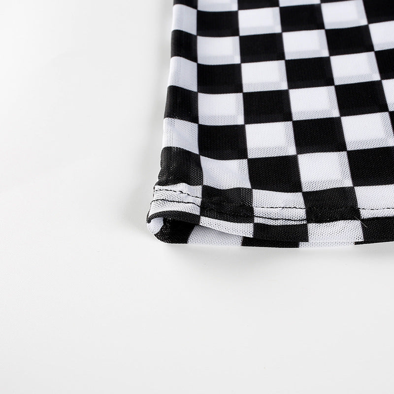 Close-up of black and white checkerboard mesh fabric showcasing the stylish grunge pattern.