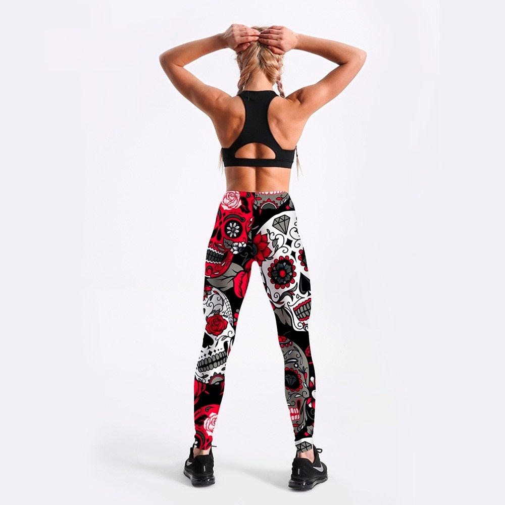 Back view of a woman in sexy skull and flower printed leggings, ideal for workout and rock style outfits.