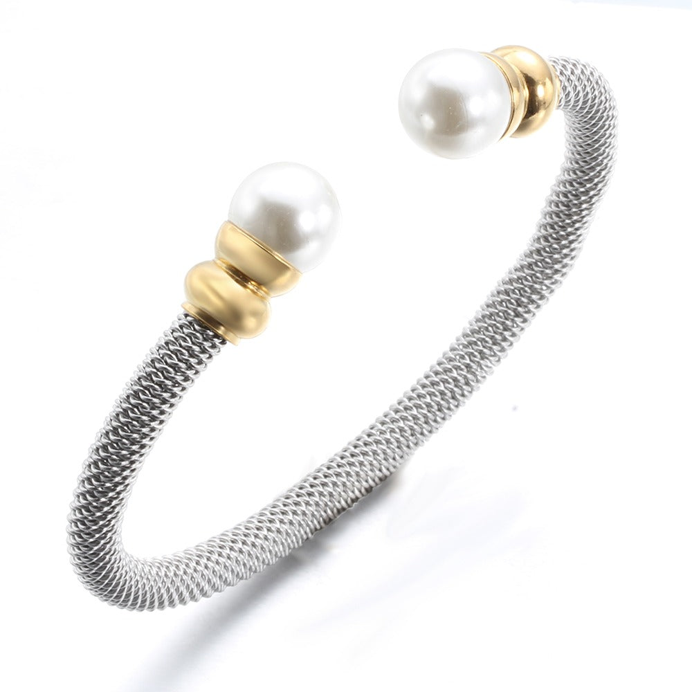 Elegant imitation pearl bracelet for women, featuring a stainless steel design in gold and silver tones.
