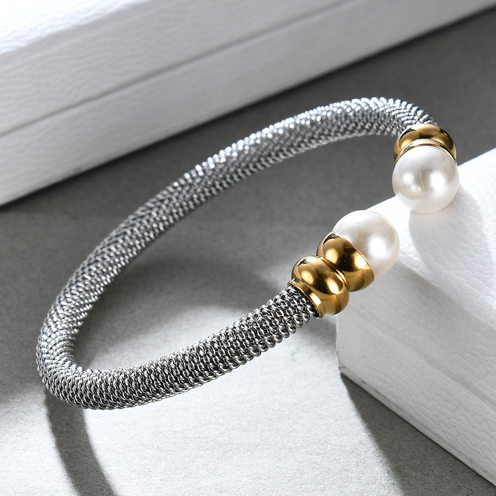 Trendy imitation pearl bracelet for women, made of stainless steel with gold accents, perfect for any stylish outfit.