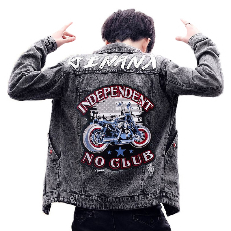 Stylish biker wearing denim jacket with Independent No Club iron-on patch featuring vibrant motorcycle design.