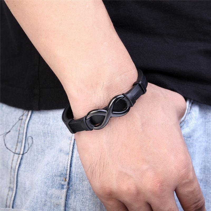 Men's vintage-style Infinity Logo bracelet in black leather with a stainless steel buckle, perfect for alternative outfits.