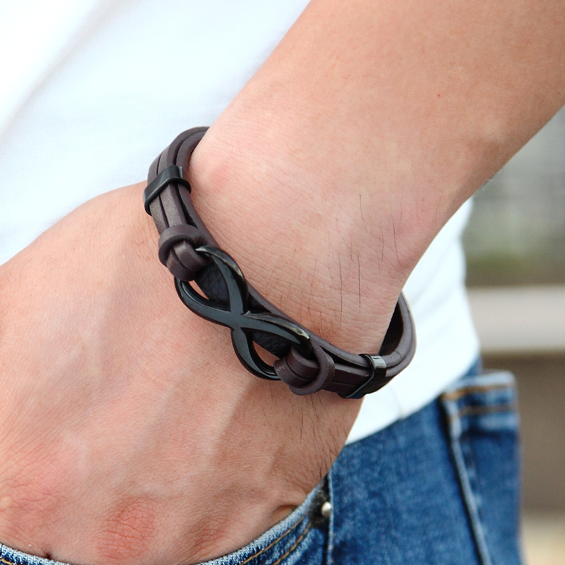Stylish infinity logo bracelet made of leather and stainless steel, perfect for vintage and alternative fashion.