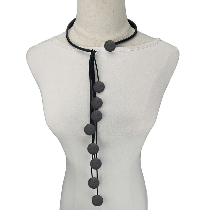 Handmade women's long tassel rubber necklace with black beads, unique female accessory for stylish outfits.