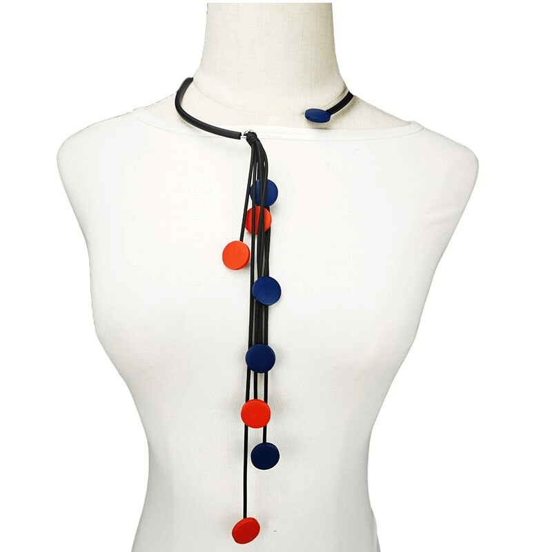 Handmade long rubber necklace with colorful tassels and wooden accents for women.