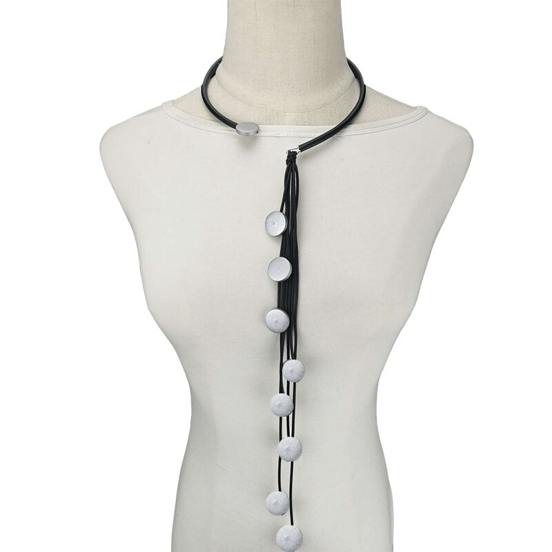 Handmade long rubber necklace with tassels and circular pendants, perfect accessory for women.