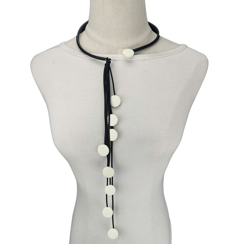 Handmade women's long tassel rubber necklace with white accents, perfect for adding style to any outfit.