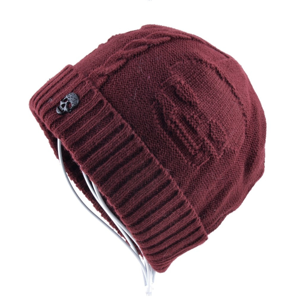 Men's knitted wool beanie with skull pattern, bold alternative fashion winter hat in burgundy.