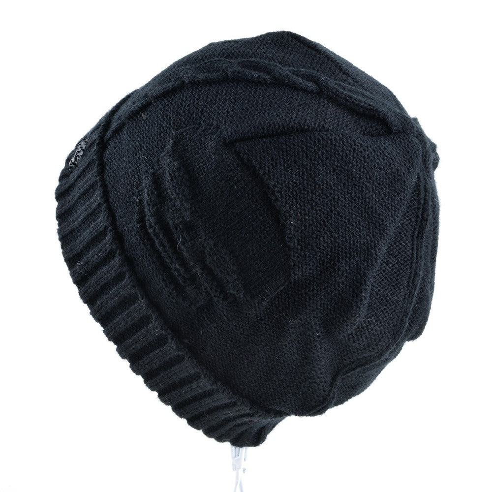 Black knitted wool beanie with distressed skull pattern, perfect for men's alternative fashion in winter.