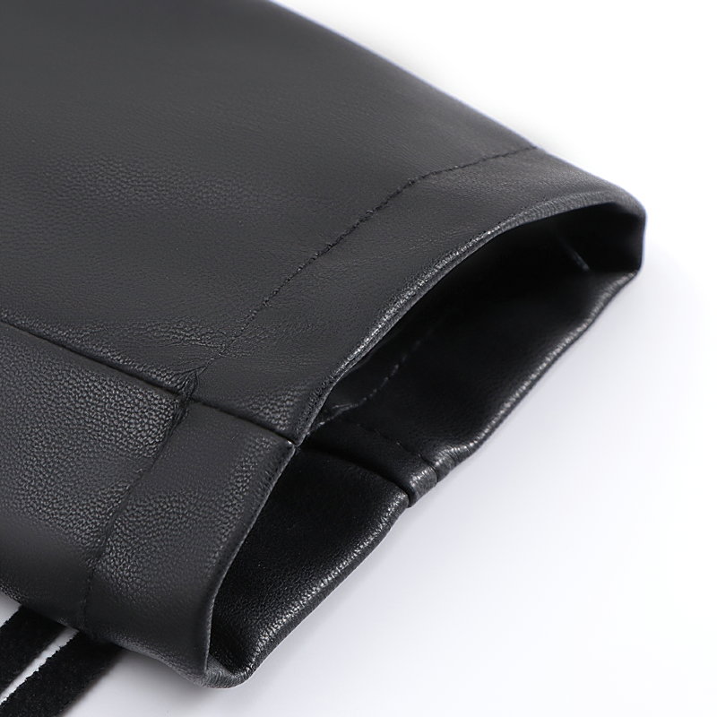 Close-up of the sleeve of a ladies cropped black PU leather biker jacket showcasing premium stitching and sleek design.