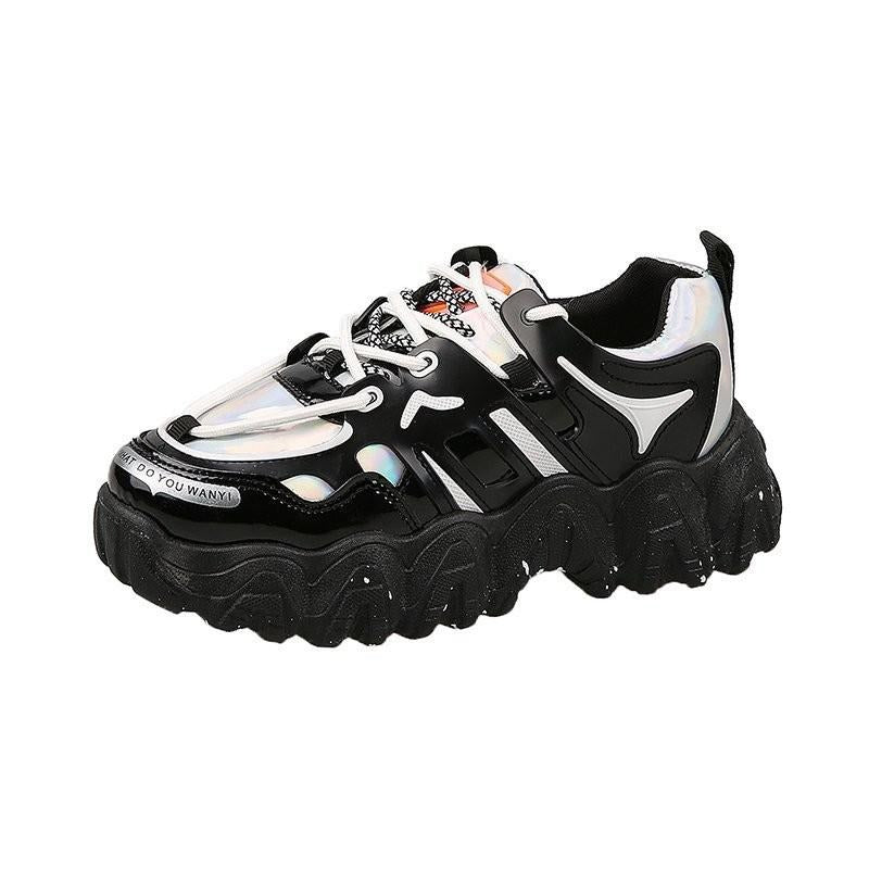 Trendy ladies black lace-up sneakers with thick platform, shiny and matte details, perfect for spring fashion.