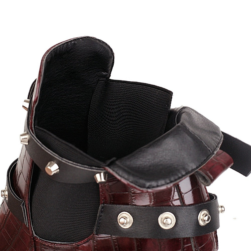 Interior view of ladies chunky high-heel ankle boots showcasing buckles and rivets, perfect for trendy cosplay outfits.