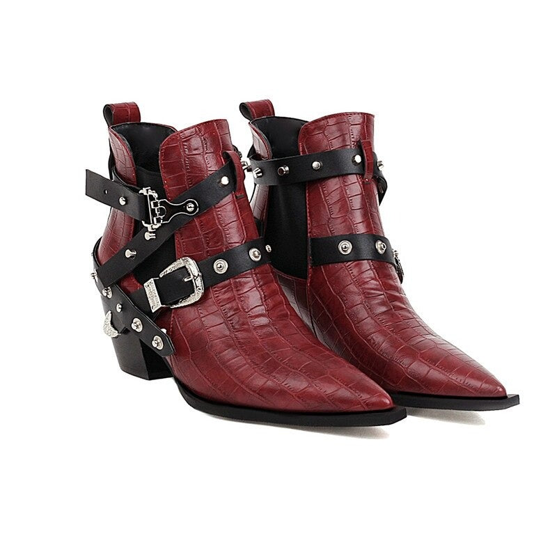 Ladies chunky high-heel ankle boots with pointed toe, buckles, and rivets in red faux leather.
