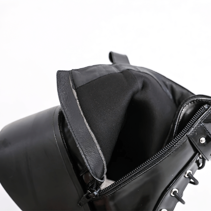 Close-up of the stylish interior of ladies goth buckle platform ankle boots, showcasing the sleek black lining.