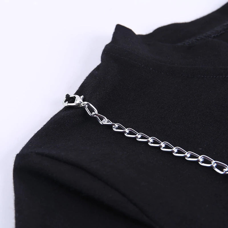 Close-up of the decorative chain detail on a ladies gothic style black crop top.