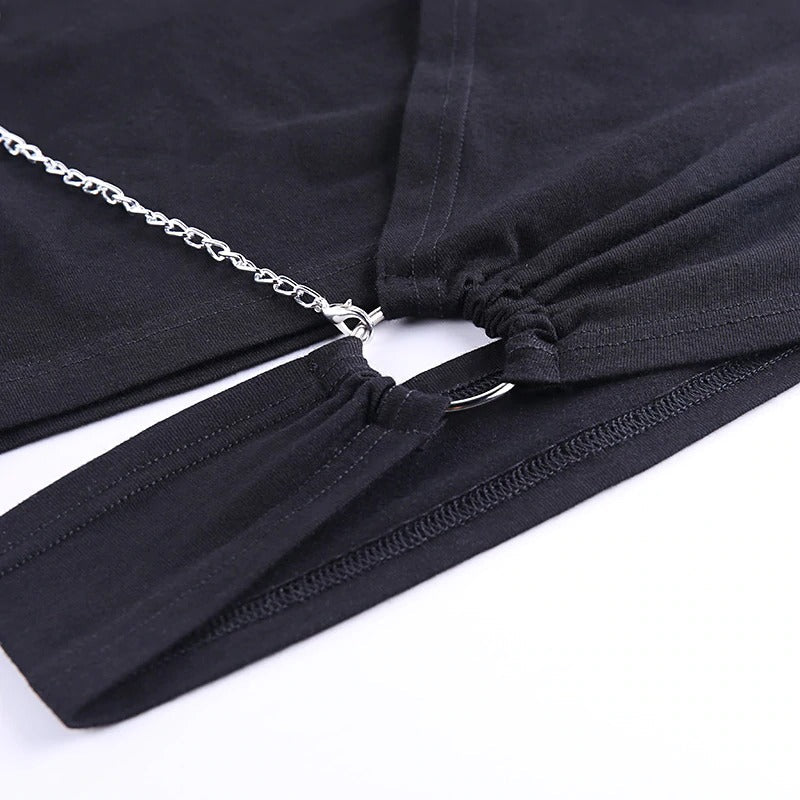 Close-up of ladies gothic black crop top with decorative chain and asymmetrical details.
