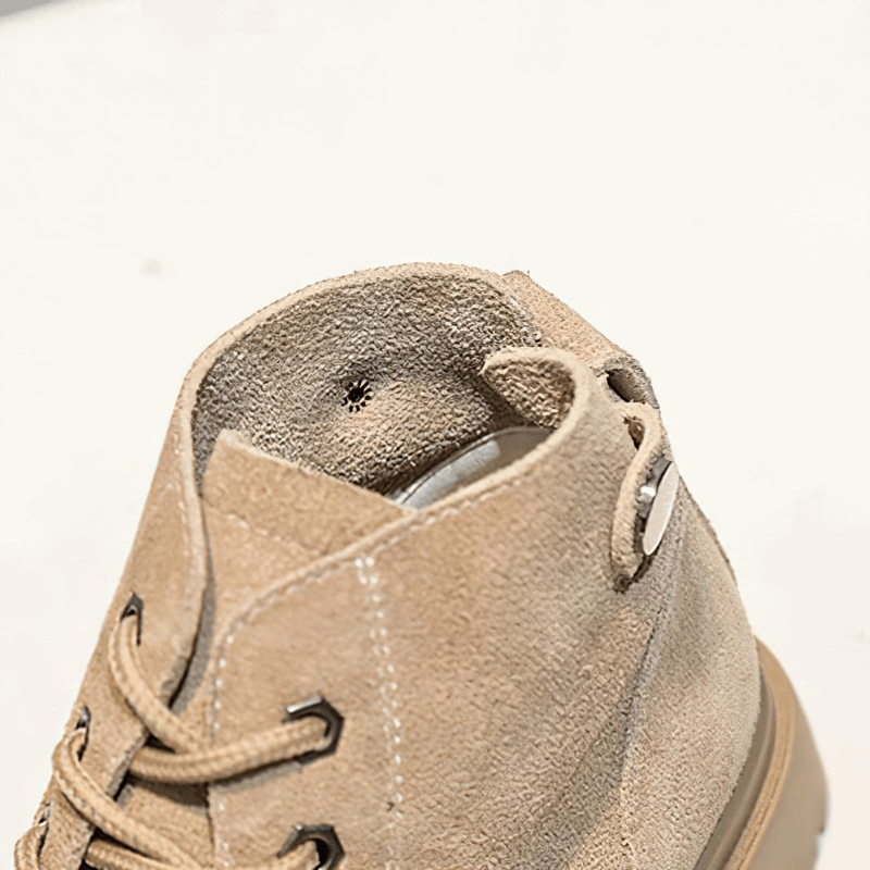 Close-up view of the soft suede interior of stylish women's lace-up ankle boots, highlighting quality craftsmanship.