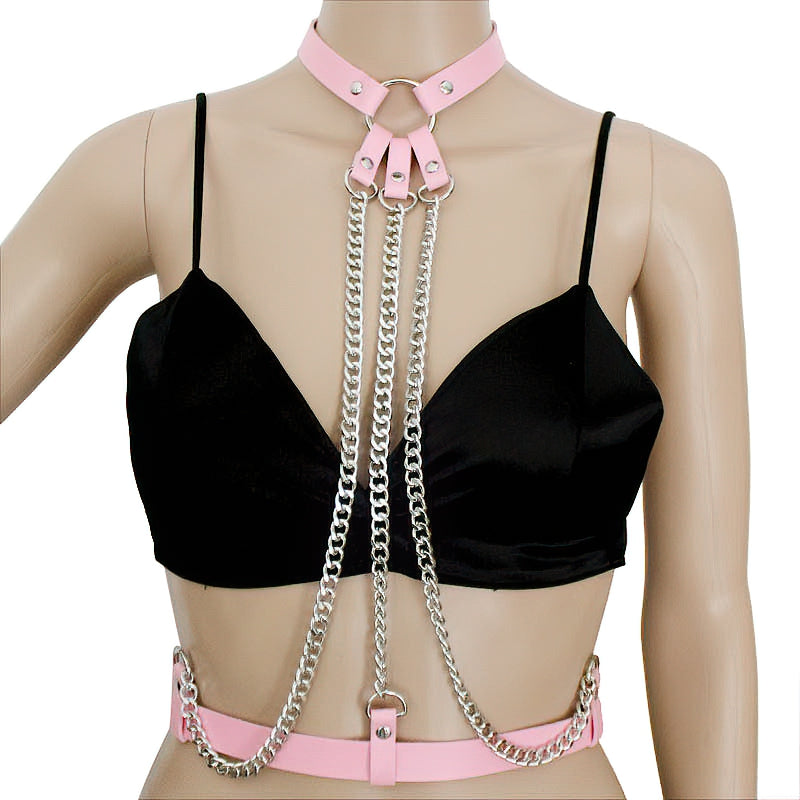 Pink leather body harness with chains, stylish alternative fashion accessory for attention-grabbing looks.