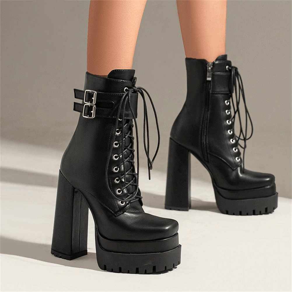 Ladies punk style black lace-up ankle boots with square high heels and buckle details.
