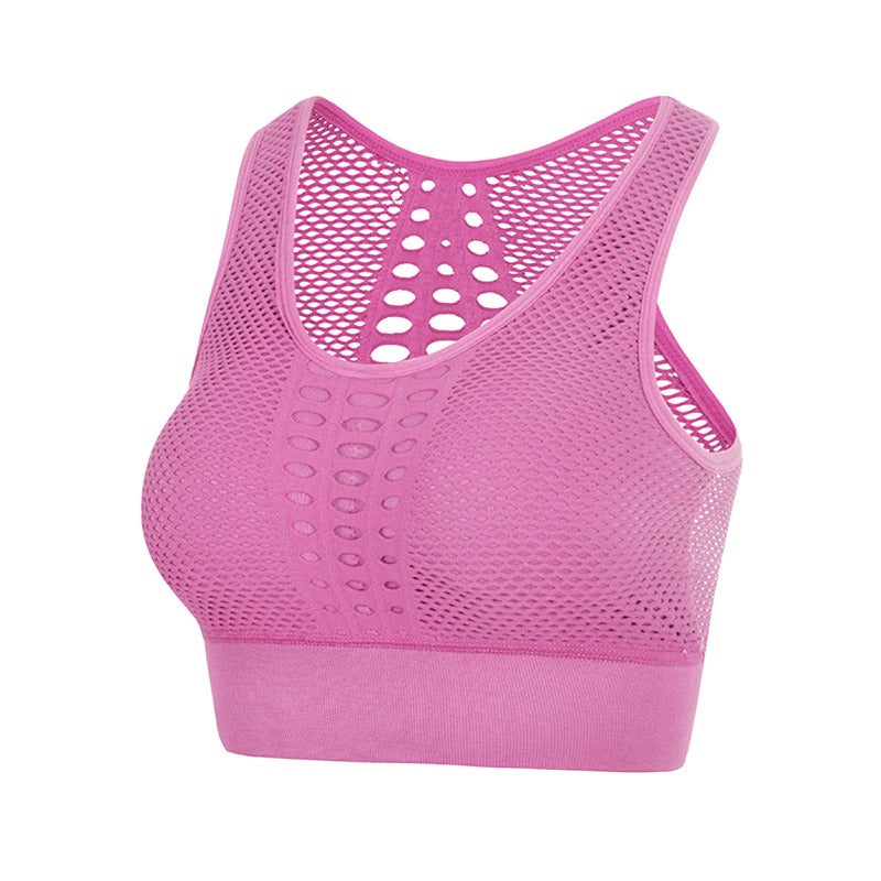 Pink seamless sports bra with breathable mesh design, perfect for women's fitness and summer workouts.