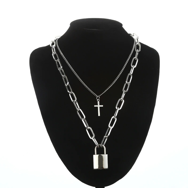 Layered punk chain necklace featuring cross pendant and padlock, trendy unisex aesthetic jewelry for fashion lovers.