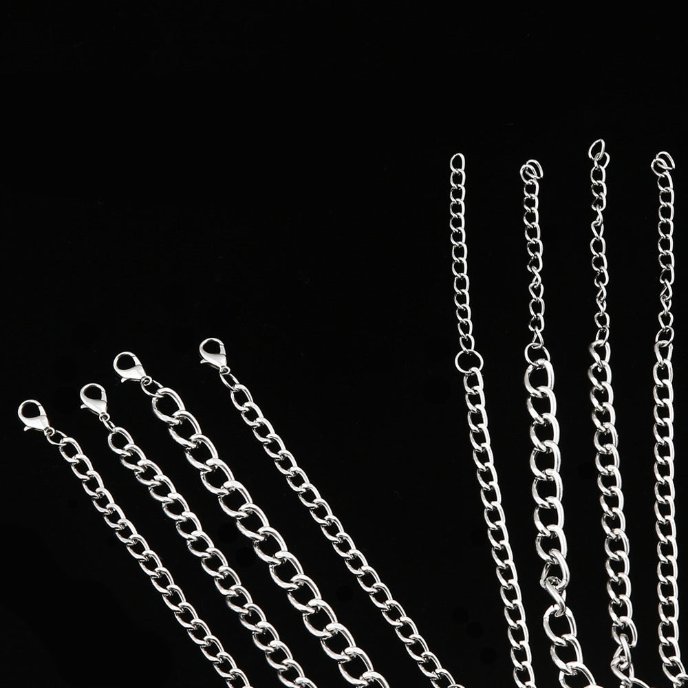 Silver layered chains showcasing different styles for unisex fashion accessories.